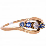 18ct Gold 1 Diamond. 4 Ceylon Sapphires. Crossover Ring. Click for more information...