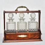 3 Bottle Oak Tantalus with Silver Plate Mounts.. Click for more information...