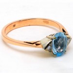 9ct Yellow Gold Aquamarine and 4 Diamond Ring. Click for more information...